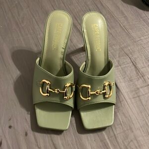 green heels with gold hardware. size: 6.5